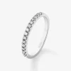 Anillo alianza media de compromiso de oro blanco de 18K con diamantes en garra 0,25ct