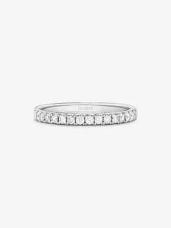 Anillo alianza media de compromiso de oro blanco de 18K con diamantes en garra 0,25ct