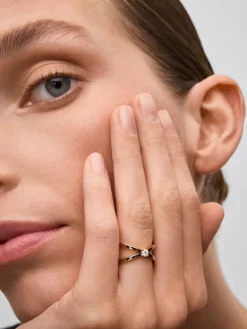 Anillo cruzado de oro rosa de 18K con diamante en talla brillante de 0,12 cts