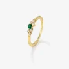 Anillo de oro amarillo de 18K con esmeralda en talla brillante de 0,1 cts y 7 diamantes en talla brillante con un total de 0,1 cts