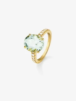 Anillo de oro amarillo de 18K con amatista verde en talla oval de 4,34 cts y 12 diamantes en talla brillante con un total de 0,29 cts