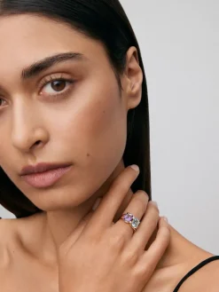Anillo de oro amarillo de 18kt con diamantes, topacios Sky y amatistas