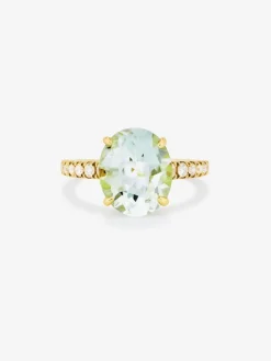 Anillo de oro amarillo de 18K con amatista verde en talla oval de 4,34 cts y 12 diamantes en talla brillante con un total de 0,29 cts
