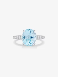 Anillo de oro amarillo de 18K con topacio azul sky en talla oval de 3,8 cts y diamantes en talla brillante
