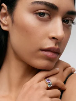 Anillo de oro amarillo de 18kt con diamantes, topacios Sky y amatistas