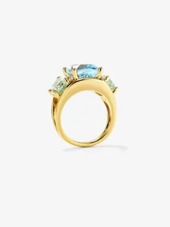 Anillo de oro amarillo de 18K con topacio azul sky en talla cushion de 5,5 cts, amatistas verdes en talla oval de 4,65 cts y diamantes blancos en talla brillante de 0,15 cts
