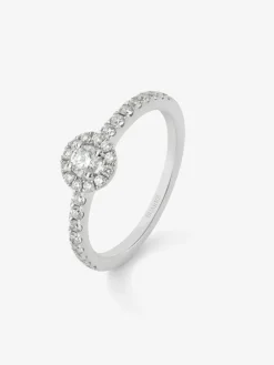 Anillo de oro blanco de 18K con diamante central en talla brillante de 0,15 cts y orla y brazo de 28 diamantes en talla brillante con un total de 0,3 cts