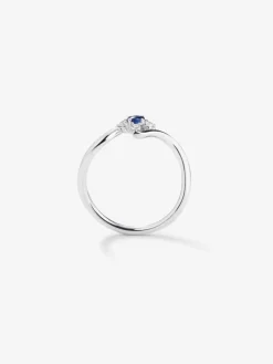 Anillo de oro blanco de 18K con zafiro azul en talla brillante de 0,15 y 4 diamantes en talla brillante con un total de 0,08 cts