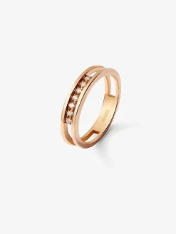 Anillo doble de oro rosa de 18K con 7 diamantes en talla brillante con un total de 0,1 cts