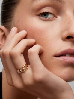 Anillo multibrazo de oro amarillo de 18K con 9 diamantes en talla brillante con un total de 0,08 cts