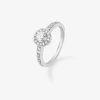 Anillo solitario de oro blanco de 18K con diamante central en talla brillante de 0,25 cts y 30 diamantes en talla brillante con un total de 0,24 cts