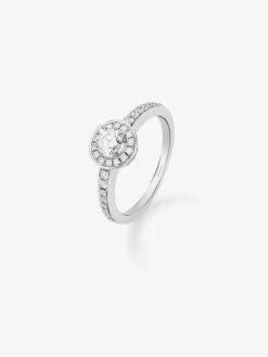 Anillo solitario de oro blanco de 18K con diamante central en talla brillante de 0,25 cts y 30 diamantes en talla brillante con un total de 0,24 cts