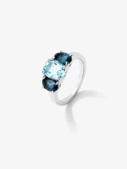 Anillo tresillo de plata 925 con un topacio azul sky en talla oval de 2,31 cts y 2 topacios azul london en talla oval con un total de 1,71 cts