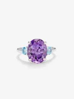 Anillo tresillo de plata 925 con amatista morada en talla oval y 2 topacios azul swiss en talla brillante