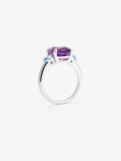 Anillo tresillo de plata 925 con amatista morada en talla oval y 2 topacios azul swiss en talla brillante