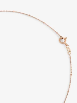 Colgante cadena largo con estrella de oro rosa de 18K con diamantes