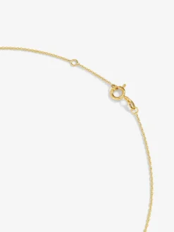 Colgante de oro amarillo de 18K con ónix negro de 1,45 cts y diamante blanco en talla esmeralda de 0,1 cts