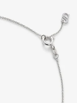 Colgante de oro blanco de 18K con un zafiro azul en talla brillante de 0,12 cts y 4 diamantes en talla brillante con un total de 0,08 cts