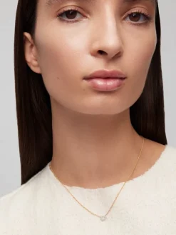 Colgante de oro blancoy amarillo de 18K con diamantes blancos en talla brillante de 0,06 cts