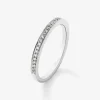 Media alianza de oro blanco de 18K con 24 diamantes en talla brillante con un total de 0,12 cts