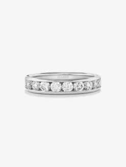 Media alianza de oro blanco de 18K con 10 diamantes en talla brillante con un total de 1,1 cts