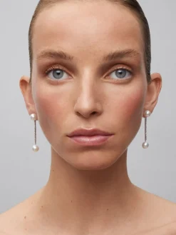 Pendientes colgante largo de oro blanco de 18K con diamante y perla
