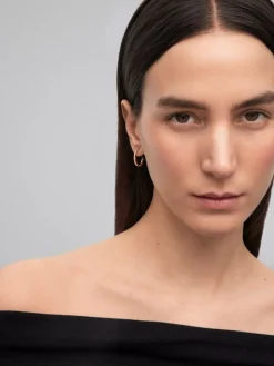 Pendientes de aro de oro amarillo de 18K con 28 diamantes en talla brillante con un total de 0,22 cts