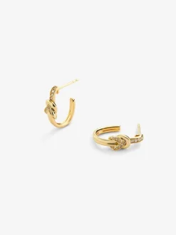 Pendientes de aro de oro amarillo de 18K con diamantes blancos en talla brillante de 0,11 cts y forma de nudo