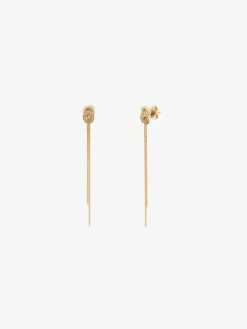Pendientes largos de oro amarillo de 18K con diamantes blancos en talla brillante de 0,5 cts y forma de nudo