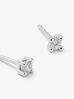 Pendientes solitarios de oro blanco de 18K con 2 diamantes en talla brillante con un total de 0,14 cts
