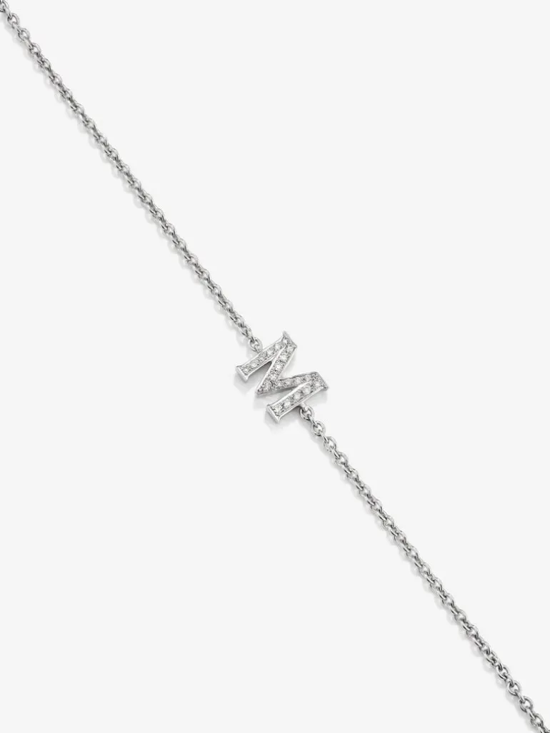 Pulsera cadena con inicial de oro blanco de 18K y diamantes