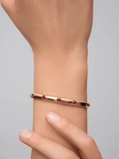 Pulsera de oro amarillo de 18K con rub&iacute;es en talla brillante de 1,2 cts