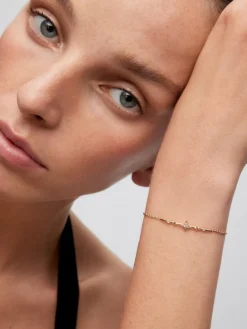 Pulsera de oro amarillo de 18K con 7 diamantes en talla brillante con un total de 0,08 cts