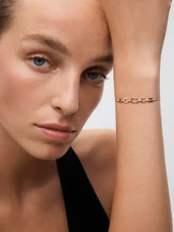 Pulsera de oro blanco y amarillo de 18K con diamantes blancos en talla brillante de 0,12 cts