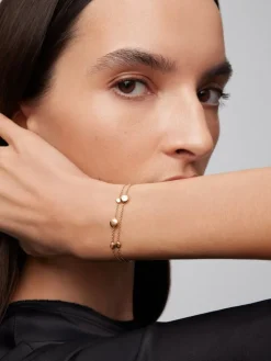 Pulsera doble de oro rosa de 18K