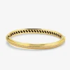 Pulsera r&iacute;gida de oro amarillo de 18K con 69 diamantes en talla brillante con un total de 0,42 cts