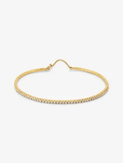 Pulsera r&iacute;gida de oro amarillo de 18K con 42 diamantes en talla brillante con un total de 0,75 cts