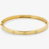 Pulsera r&iacute;gida de oro amarillo de 18K con diamantes blancos en talla brillante de 0,13 cts