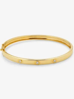 Pulsera r&iacute;gida de oro amarillo de 18K con diamantes blancos en talla brillante de 0,13 cts