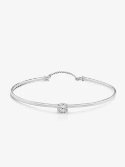 Pulsera r&iacute;gida de oro blanco de 18K con 11 diamantes en talla brillante con un total de 0,2 cts