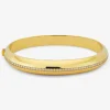 Pulsera r&iacute;gida de oro amarillo de 18K con pavé de diamantes en talla brillante