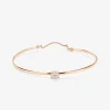 Pulsera r&iacute;gida de oro rosa de 18K con 11 diamantes en talla brillante con un total de 0,21 cts