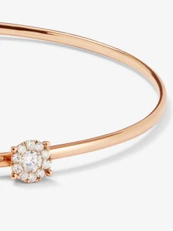 Pulsera r&iacute;gida de oro rosa de 18K con 11 diamantes en talla brillante con un total de 0,21 cts