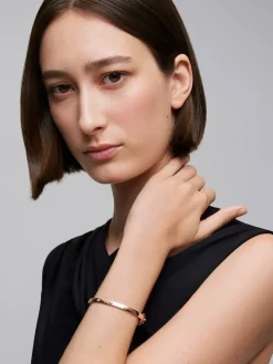 Pulsera r&iacute;gida de oro rosa de 18K con diamantes blancos en talla brillante de 0,13 cts