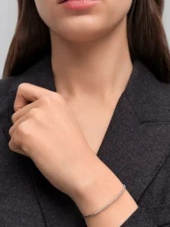 Pulsera r&iacute;gida de oro blanco de 18K con diamantes blancos en talla brillante de 0,39 cts
