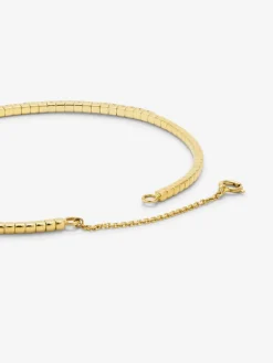 Pulsera r&iacute;gida de oro amarillo de 18K con 42 diamantes en talla brillante con un total de 0,75 cts