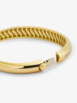 Pulsera r&iacute;gida de oro amarillo de 18K con pavé de diamantes en talla brillante