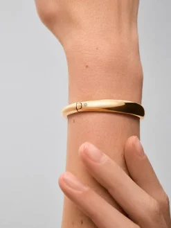 Pulsera rígida lisa de oro amarillo de 18K con diamante