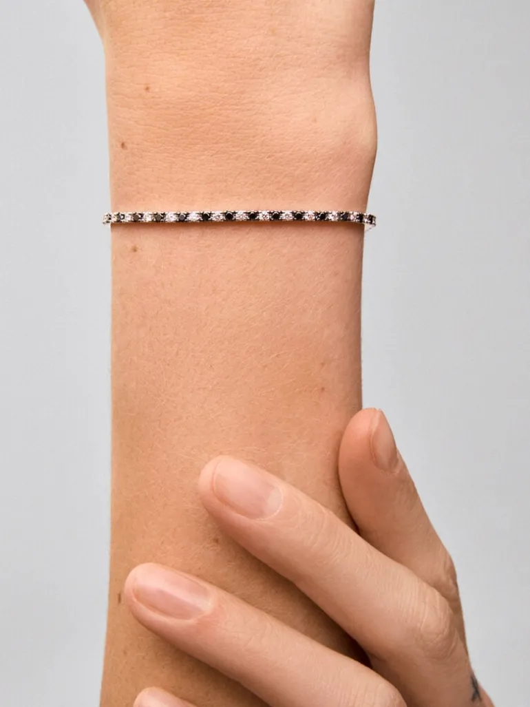 Pulsera riviere de oro blanco de 18K con diamante negro y diamante blanco